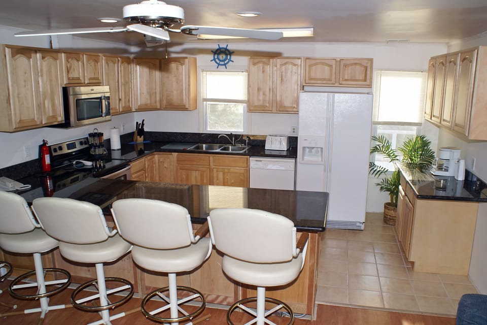 Breakfast bar - seats 6, and kitchen, now has new SS Refrigerator/freezer