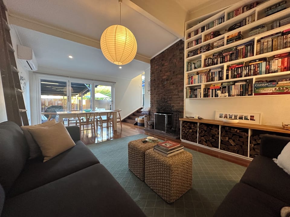 Lounge with open fireplace, library and dining
