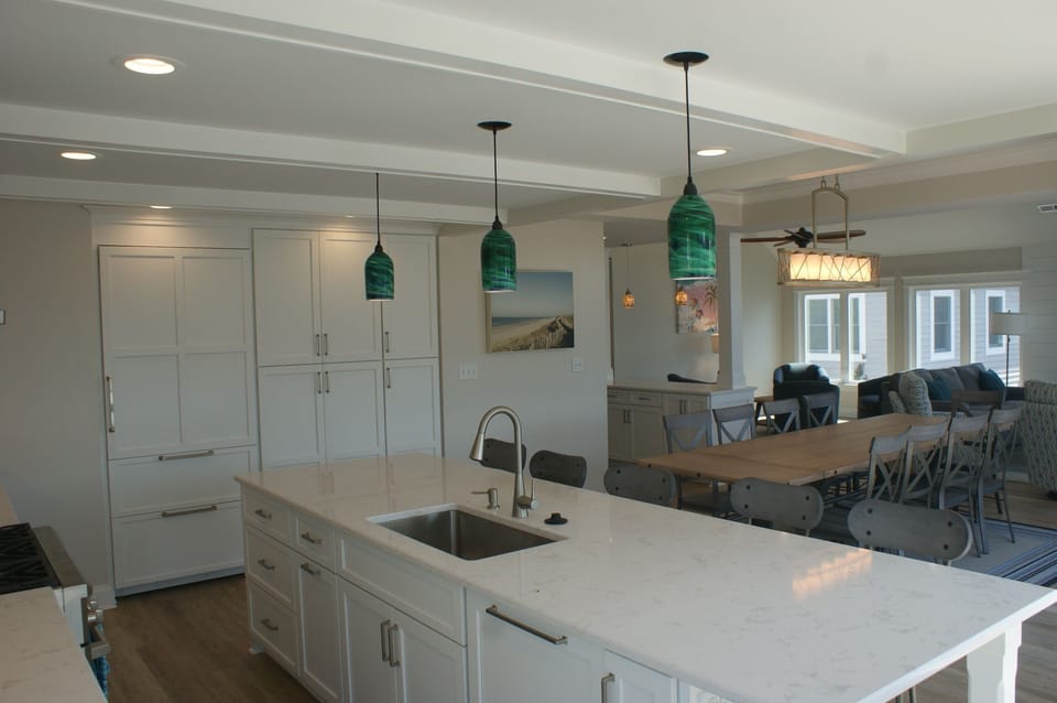 The kitchen has built-in cabinets and Subzero refrigerator.