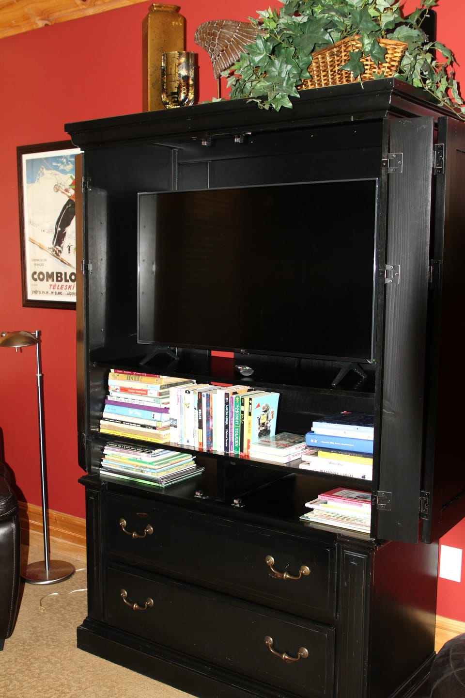 Smart TV in dresser in bunk room.