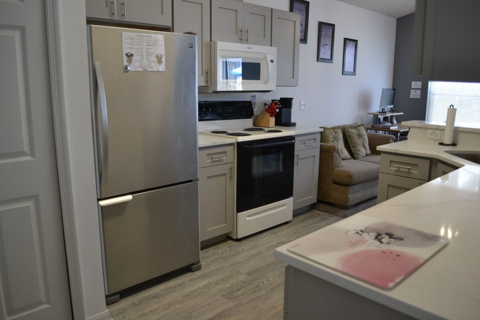 Large fridge/freezer, cooker, hob,  microwave and Keurig k-cup coffee maker.