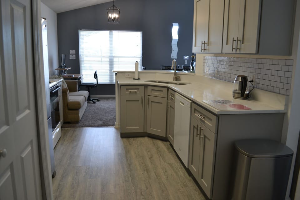Premium vinyl flooring, kitchen cupboards and quartz worktops.  