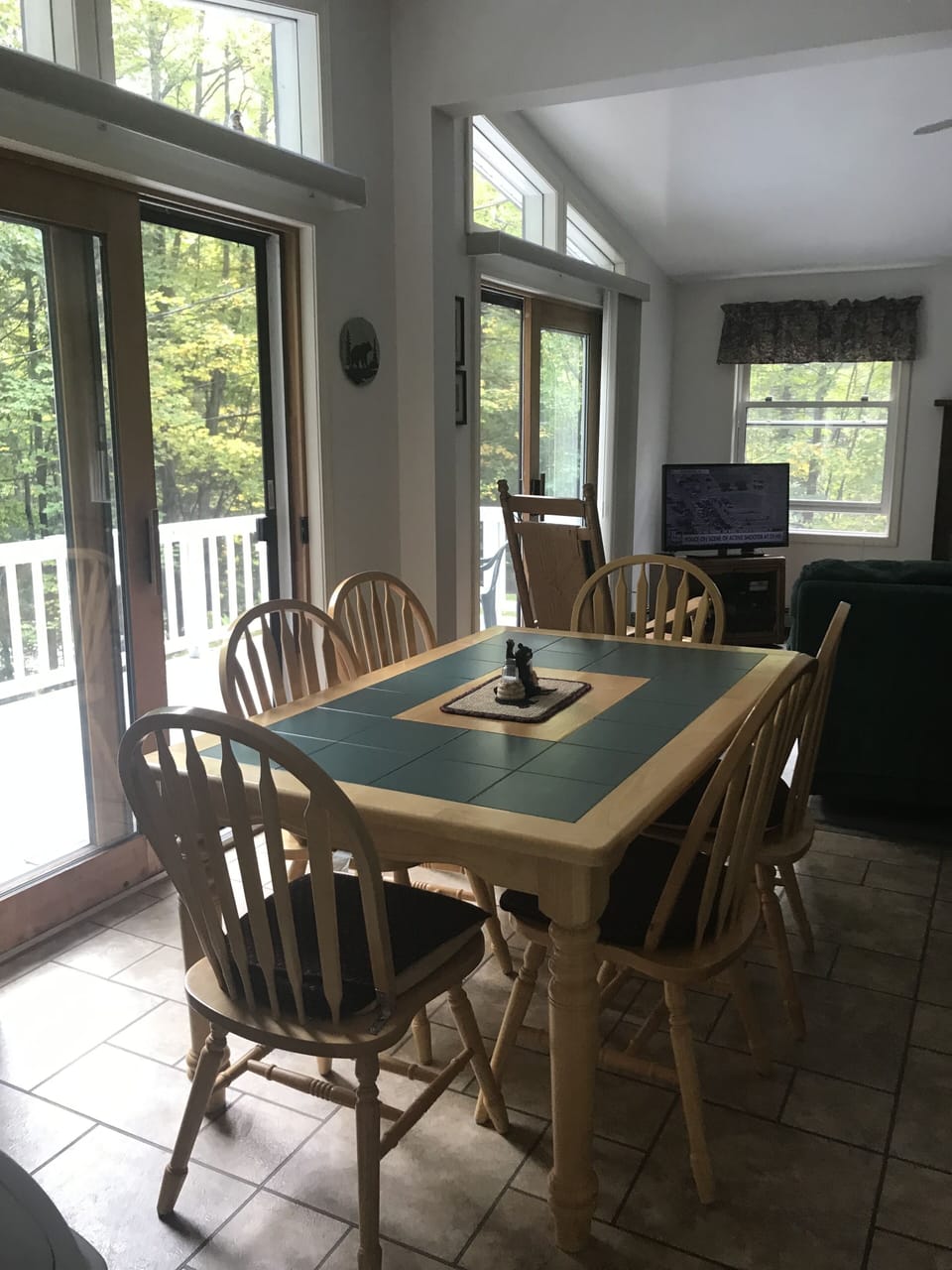 Table for six. Four more on the sun porch.