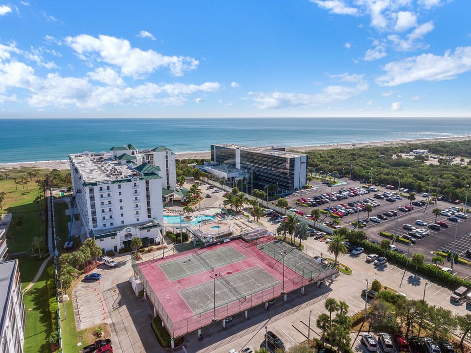 Bird's-eye view overlooking tennis and basketball courts