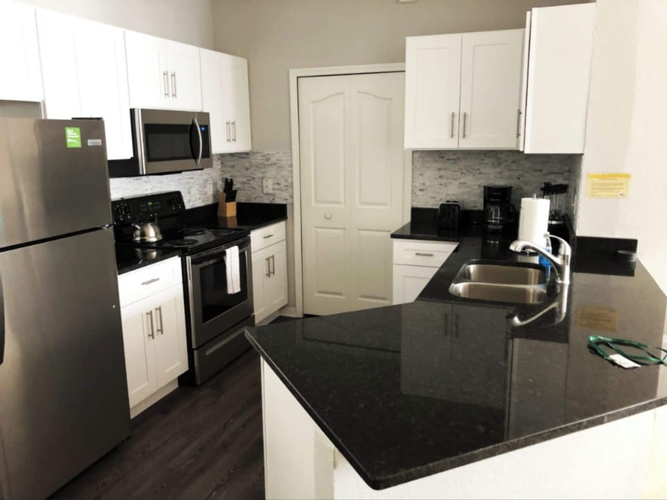 Microwave, dishwasher, coffee/tea maker, cookware/dishes/utensils