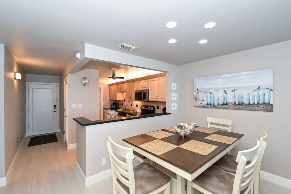 Dining area is right off the kitchen with seating for six