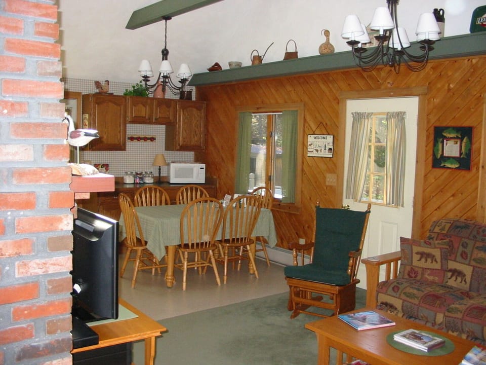 Living & Dining in Great Room with Vaulted Ceiling and Skylight!