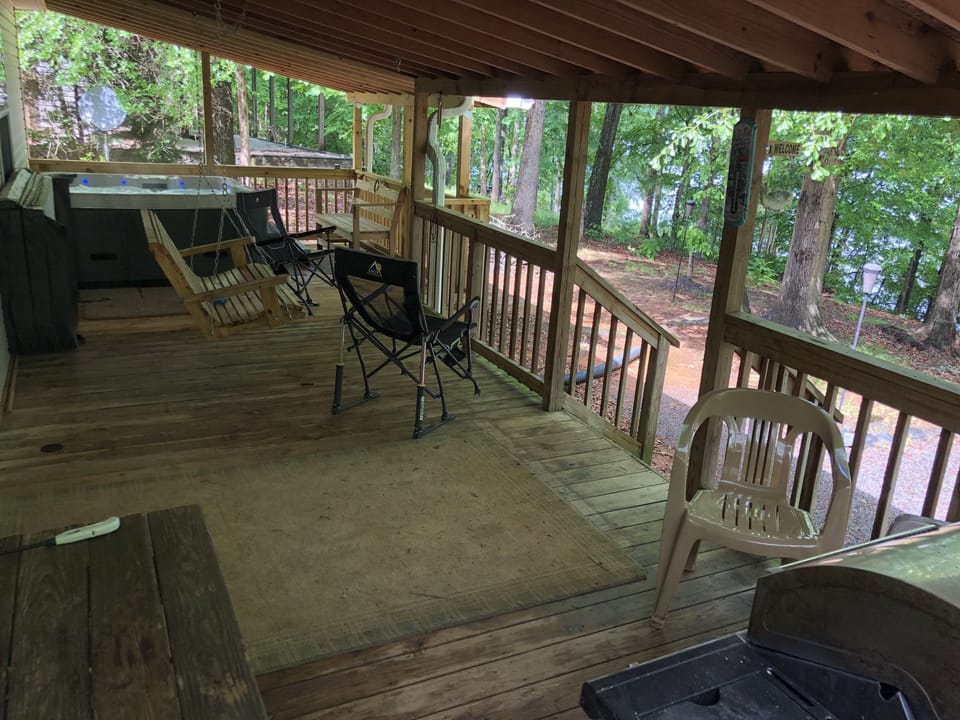 Back porch swing, hot tub, bench, gas grill & camping chairs. LAKE VIEWS