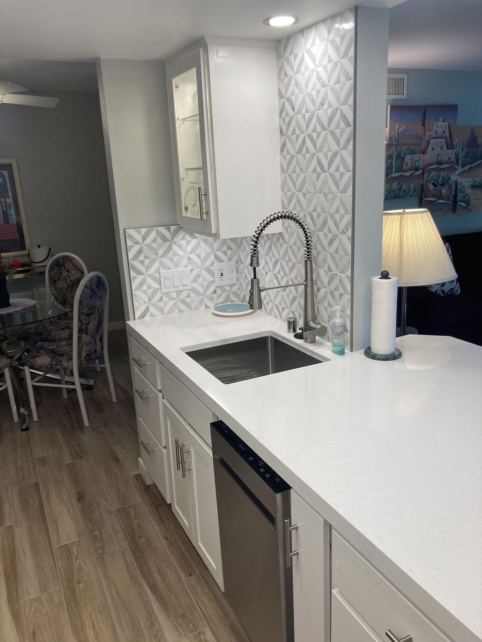 Stainless steel sink with Kohler faucet.  Mini dishwasher 