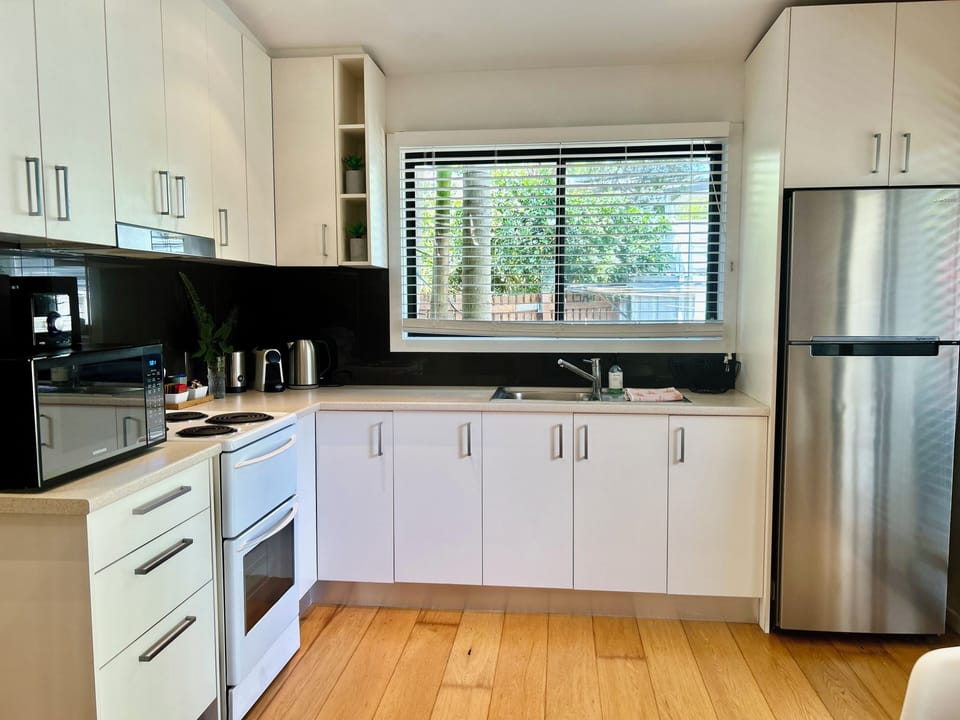 Coffee/tea maker, fridge, microwave, oven