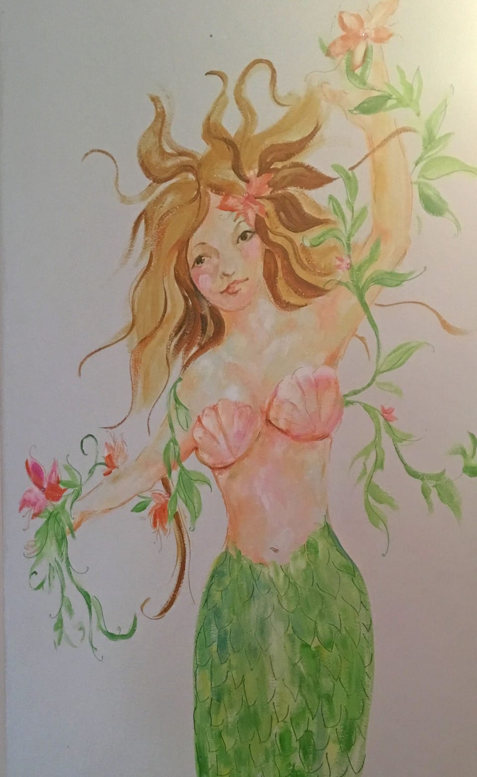 Mermaid art tucked away on a wall