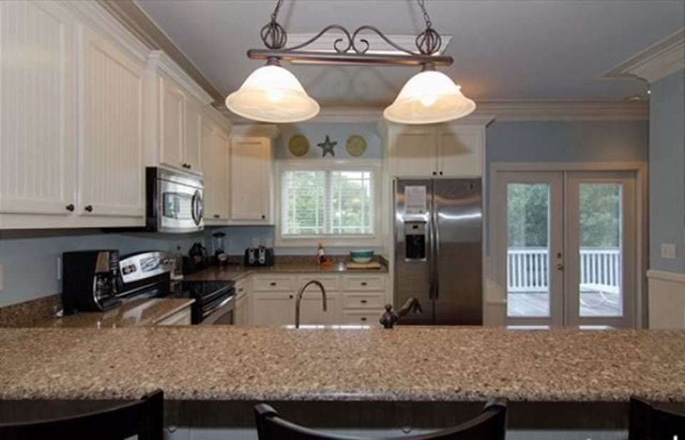 Kitchen with Additional seating at bar