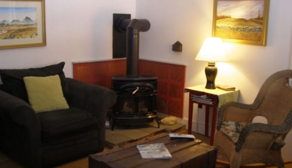 Living Room with satellite tv, fvf, Vt. Castings fireplace