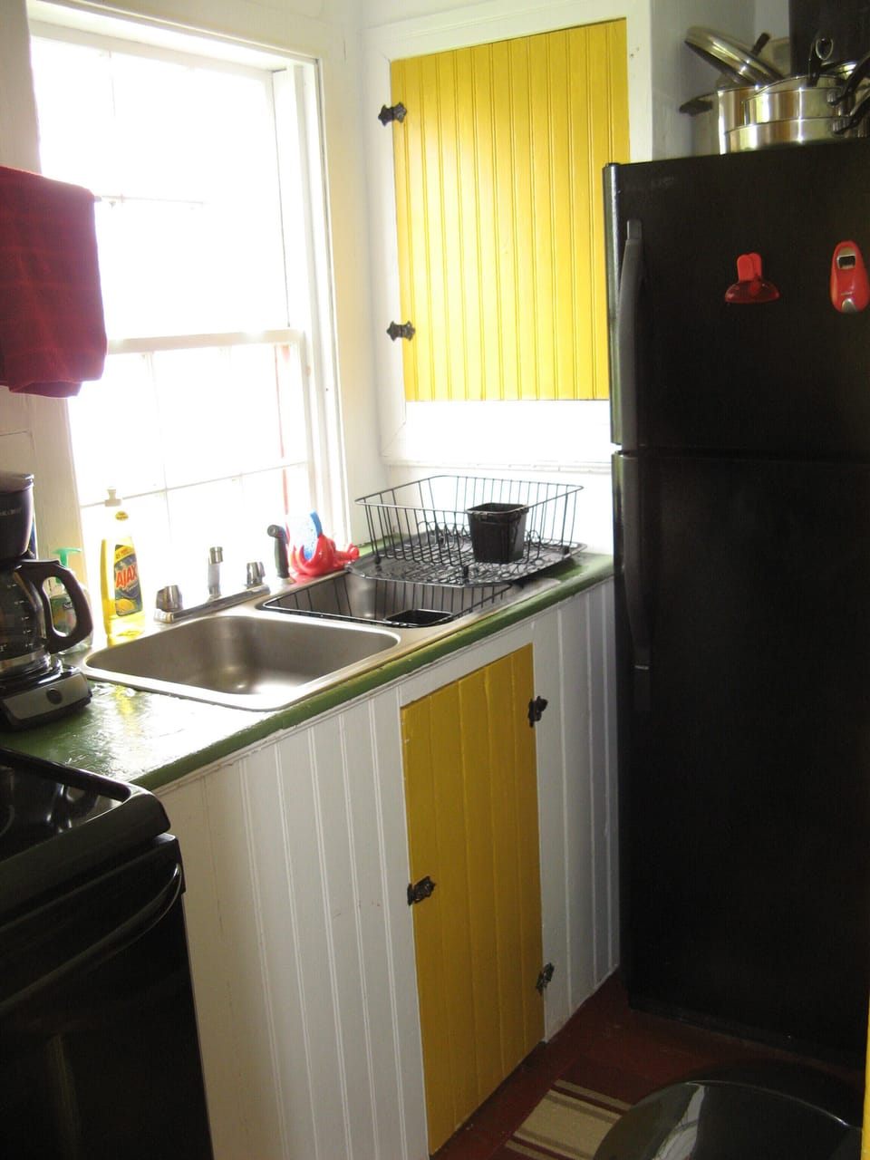 The cheery galley kitchen has a magnificent view!