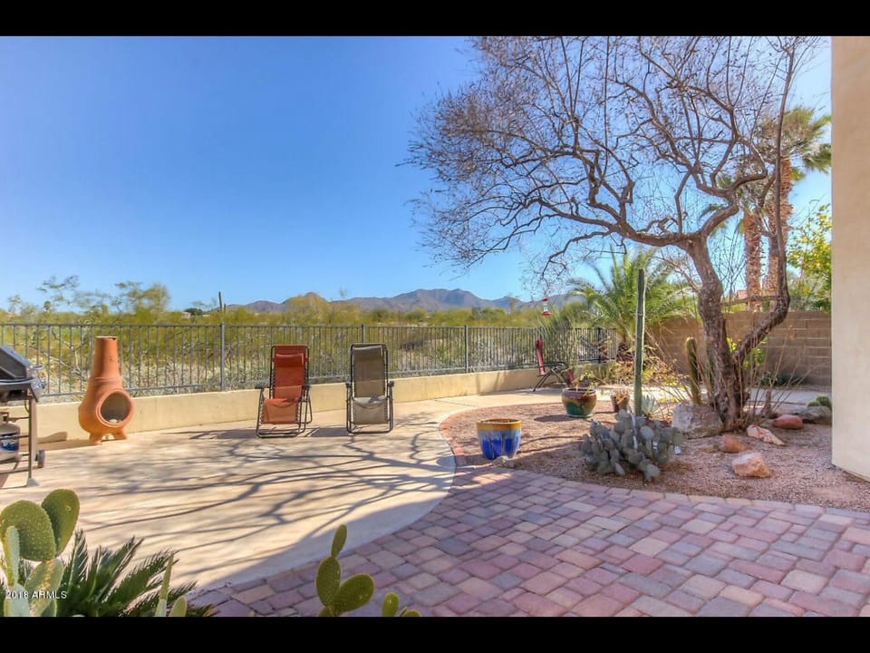 Patio view of #10 fairway of Red Mountain Ranch Golf Course and mountains