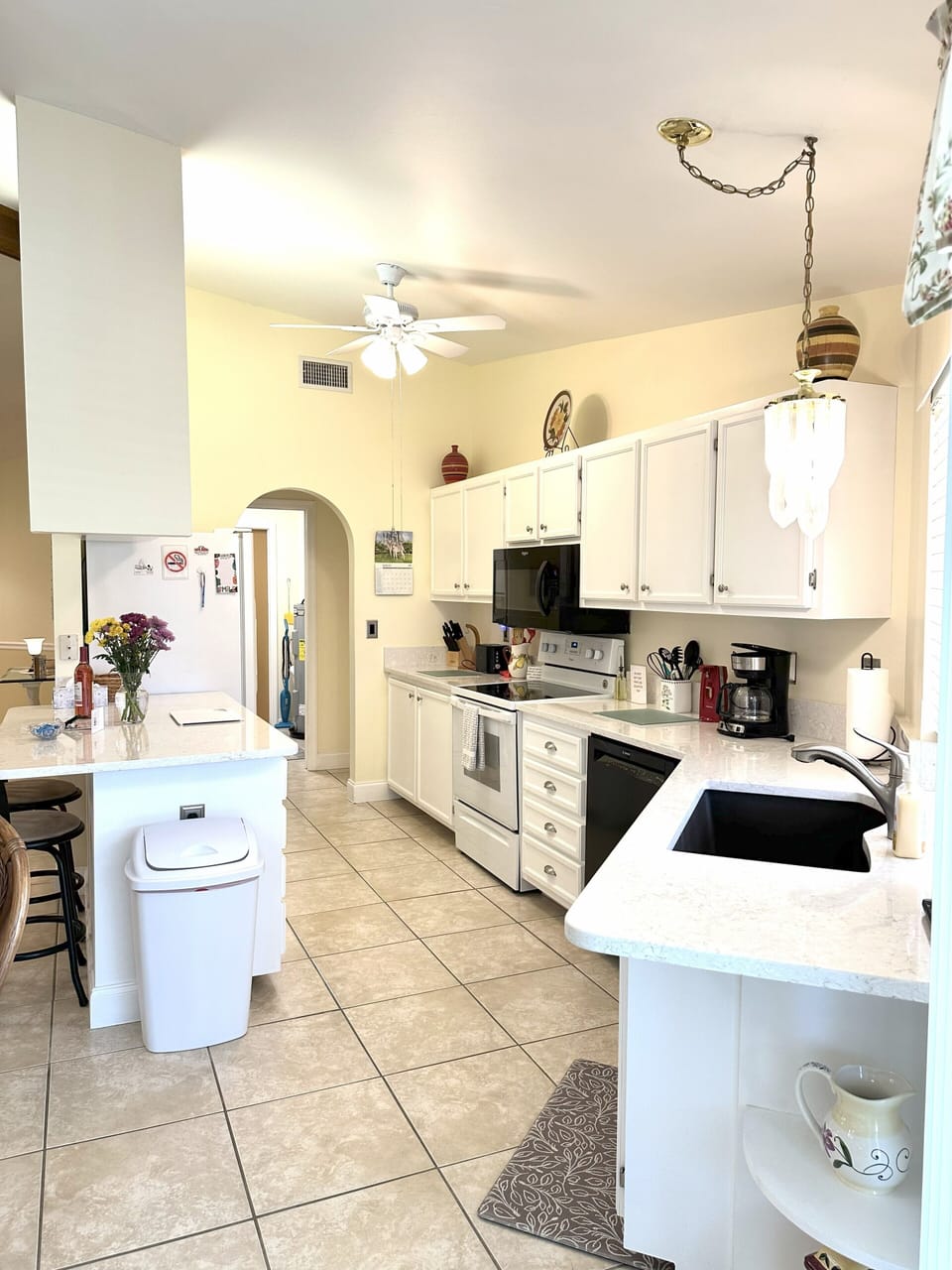 Open floor plan with easy access to kitchen, dining & living room and pool area
