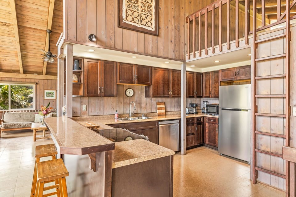 Kitchen and captains ladder to one of the lofts.