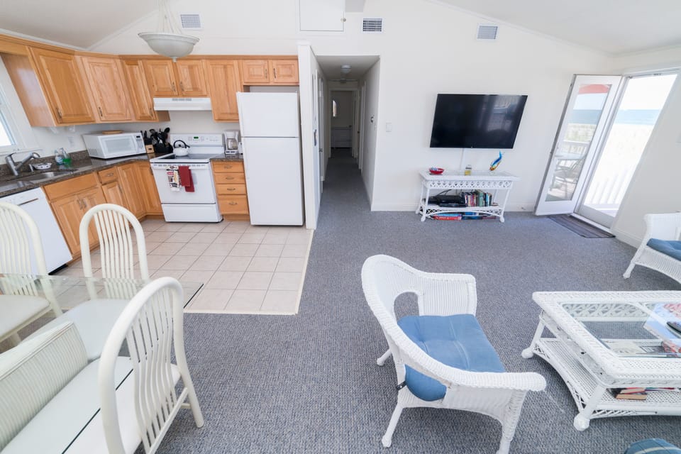 The upstairs cathedral ceilings add height to the living area