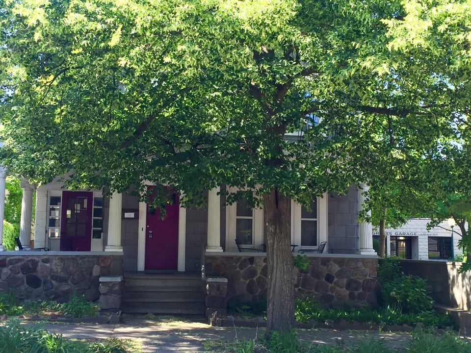 Front of the duplex. Left door goes to Main floor, front door in middle goes up
