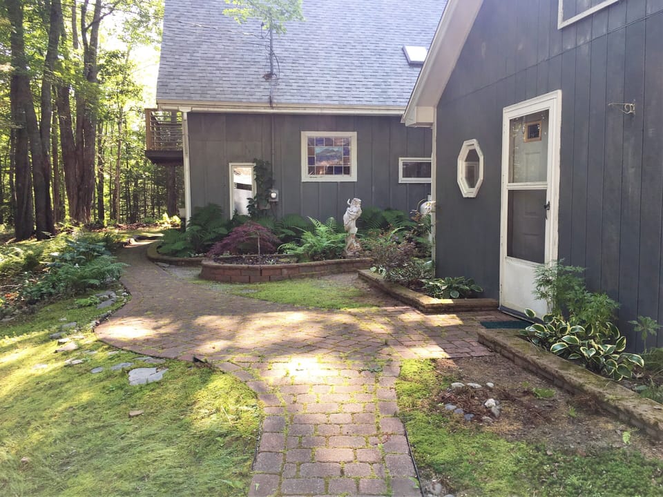 Stone path with side garden.