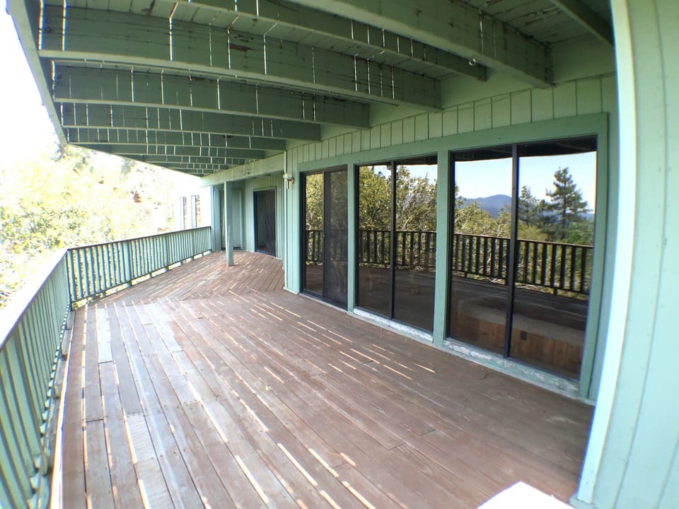 Large lower deck off game room, hot tub, gym, & 2 bedrooms.