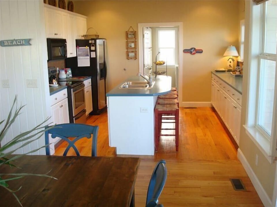 Kitchen with row of windows that look out over the tidal marsh 