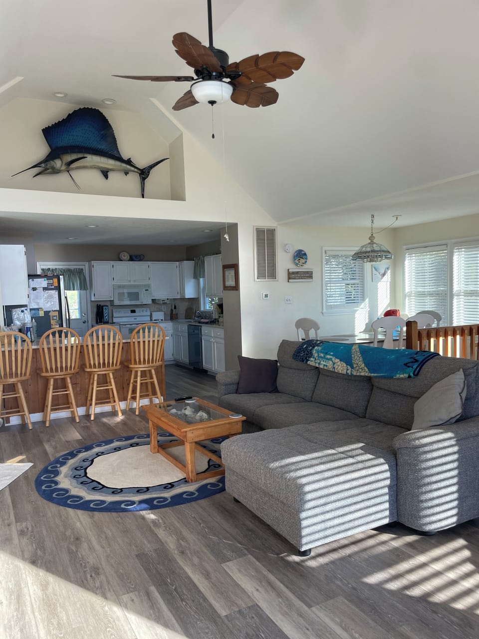 Comfy seating in great room with sofa/lounger, rocker, chair/ottoman & lounger