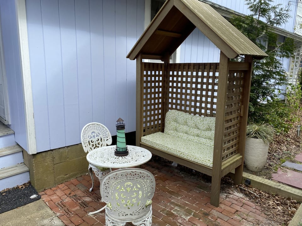 Side patio with additional seating
