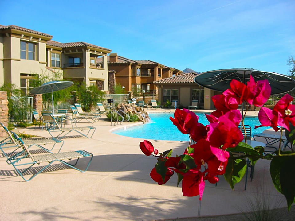 Beautiful flora and waterfalls surround heated pool and spa steps away!