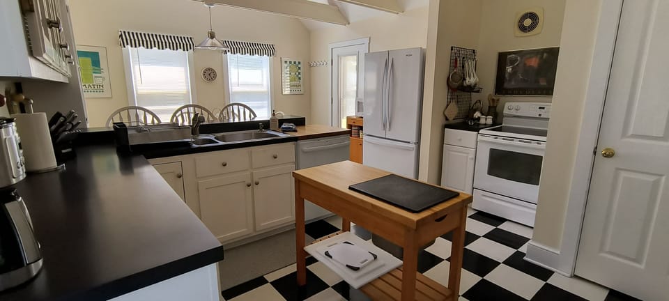 Kitchen fully equipped with island on wheels