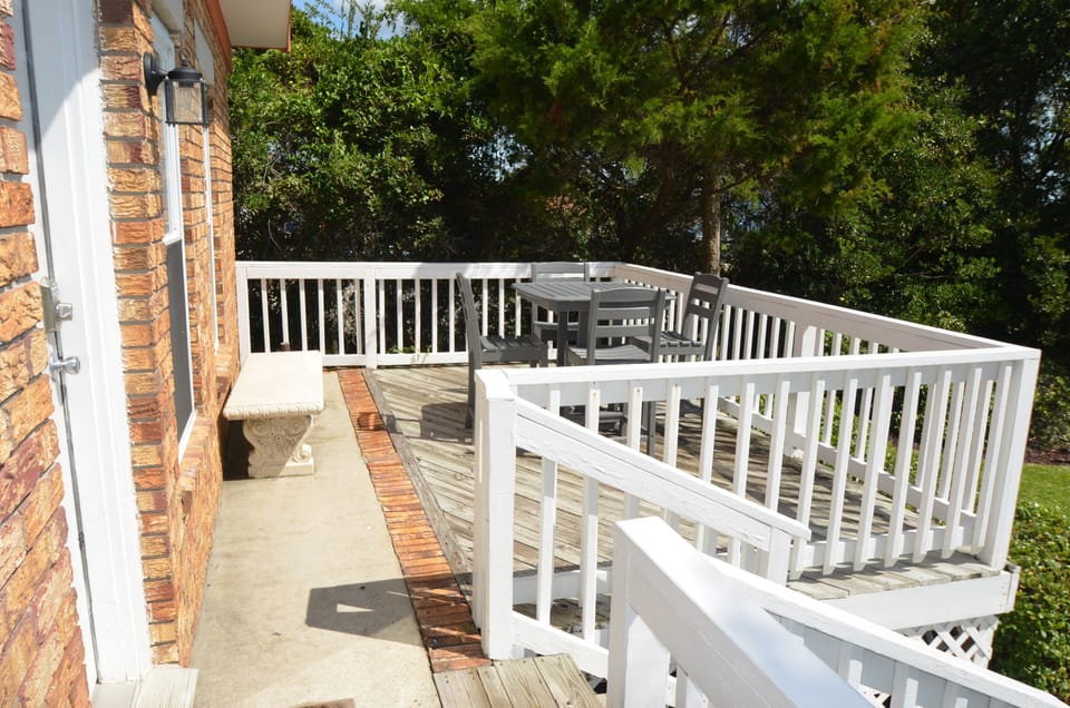 "What happens on the porch...."  Great pub table and chairs to enjoy sun and fun.