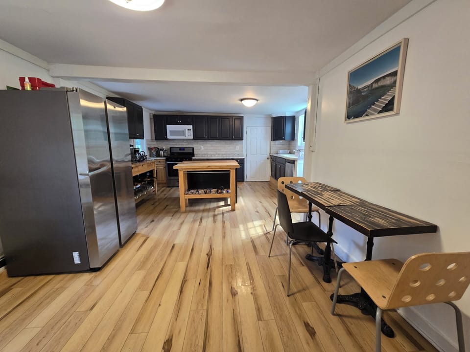 microwave, kitchen visible, indoor, kitchen, oven, refrigerator, stovetop