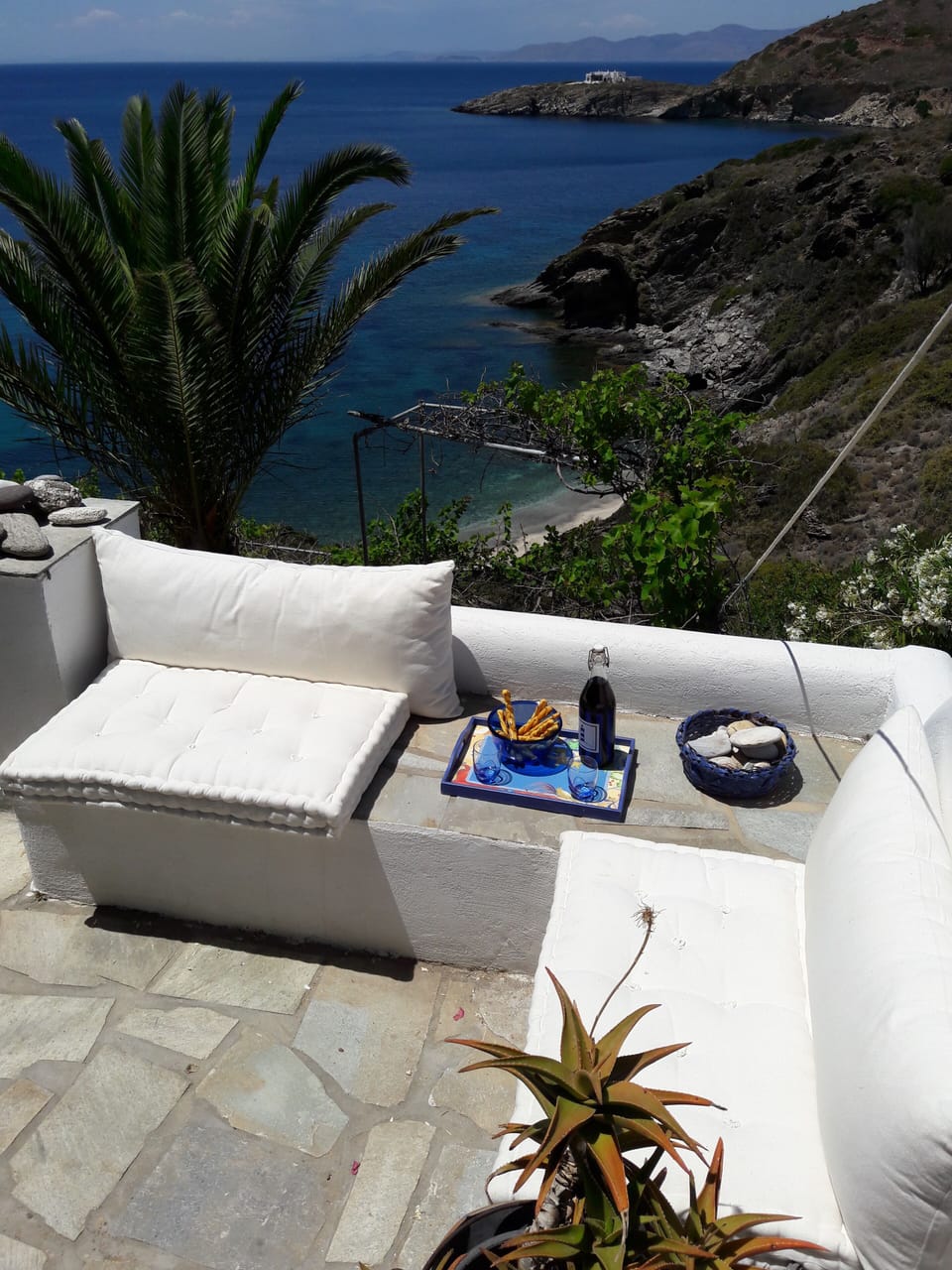 Relax with some wine and enjoy the mesmerizing Aegean sea view 