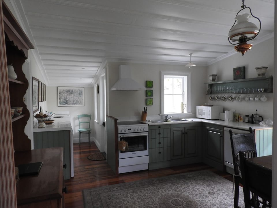 The fully equipped kitchen has French doors onto the veranda for alfresco meals.