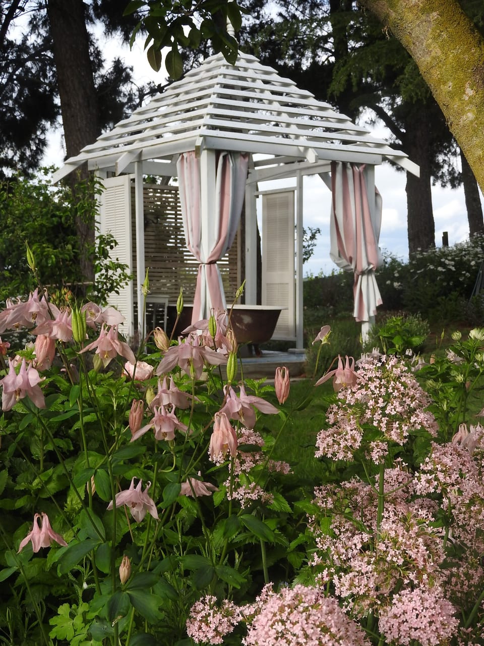 The hot tub in the garden.