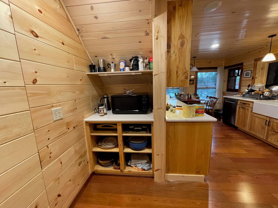 Under-stairs nook with large microwave