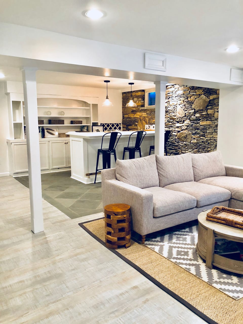 Basement entertainment area. Bar, wine fridge.