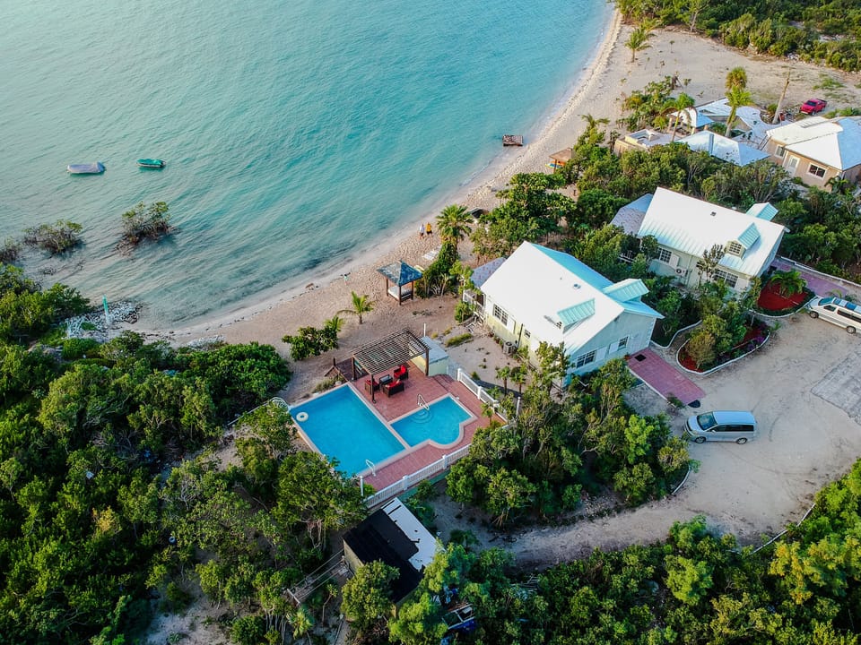 Two cottages situated directly on the beach. This cottage #2 is next to the pool