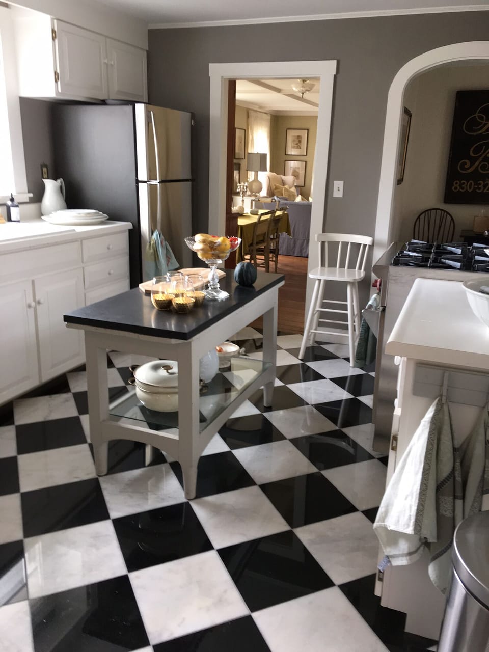 Newly remodeled kitchen with stainless steel refrigerator and Wolf stove.