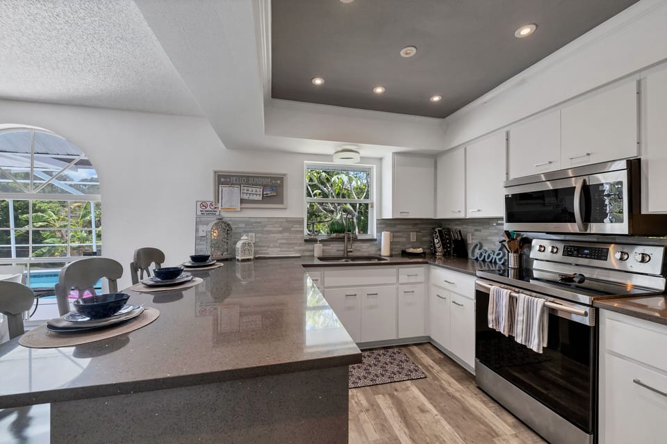 Kitchen counter has 4 stools for informal dining
