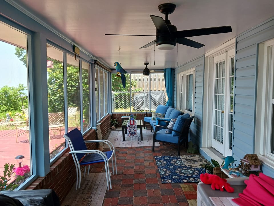 updated outdoor furniture on the screened porch