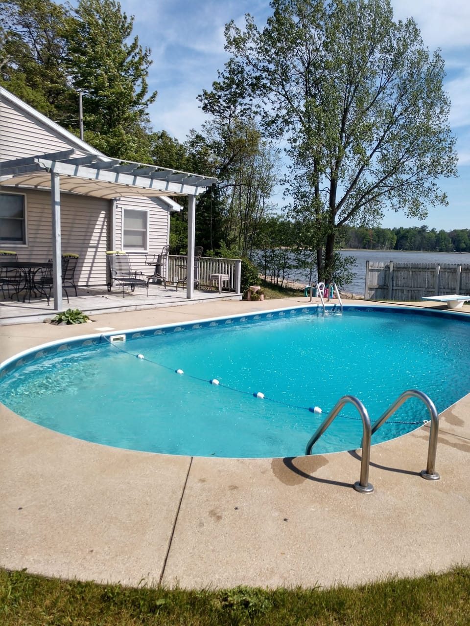 Inground pool 16x32 with pergola and grassy yard overlooking Fox Lake