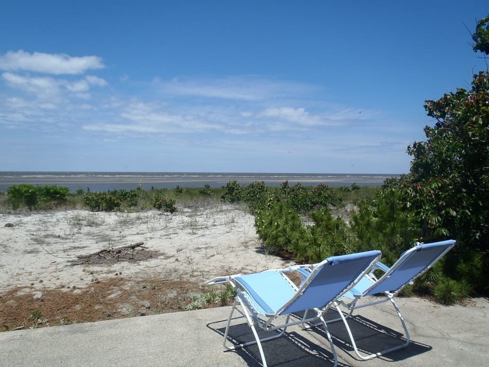 Enjoy unobstructed water views from beach front patio
