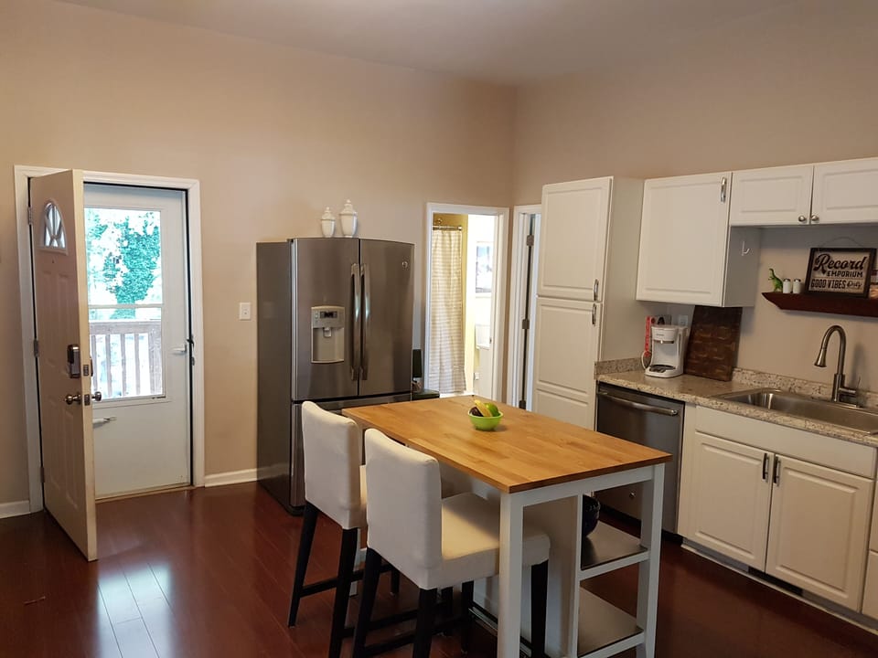 Relax with view of serene backyard from the kitchen, living and dining rooms! 