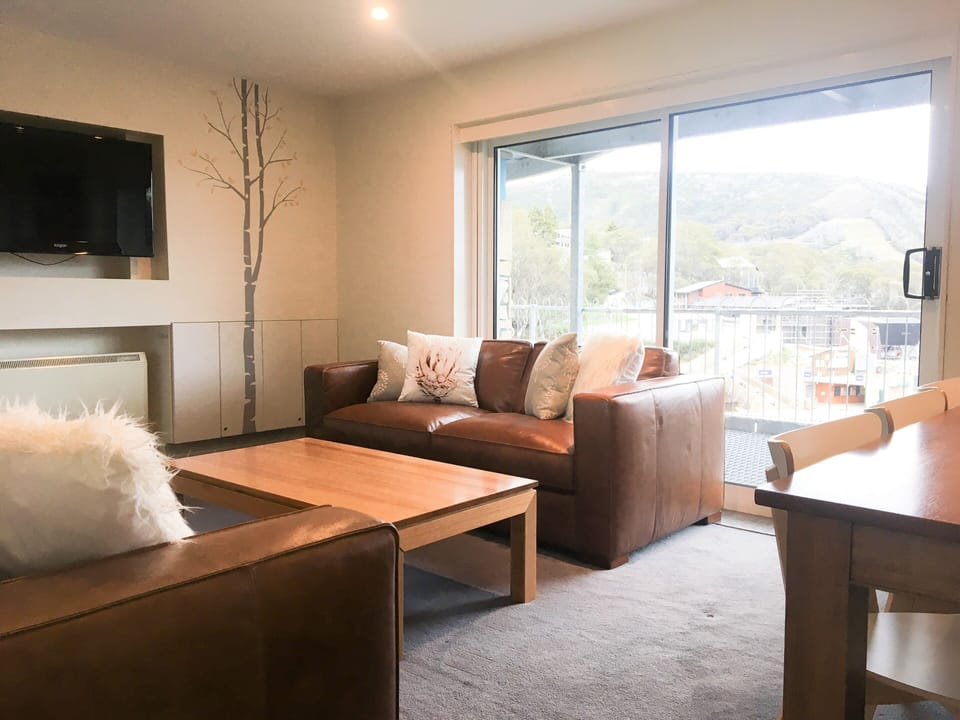 Comfortable leather lounges with large sliding door to your own huge balcony
