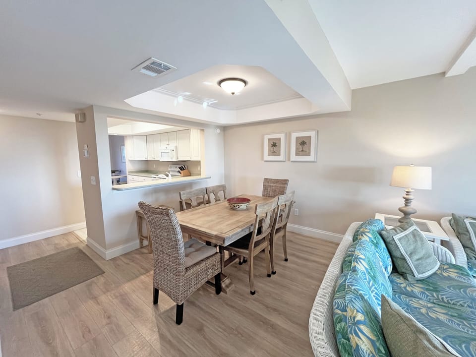 Family Room, Dining table and kitchen .  There is a powder room on this level.