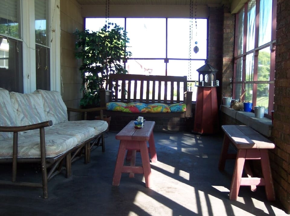 Relaxing  23' Brick Enclosed Screen Porch.