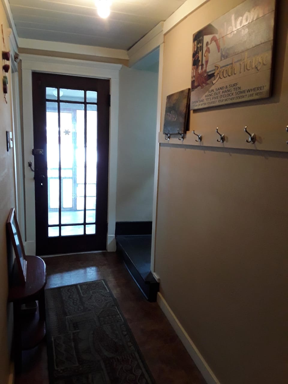 Entrance hall to enclosed screen porch.
