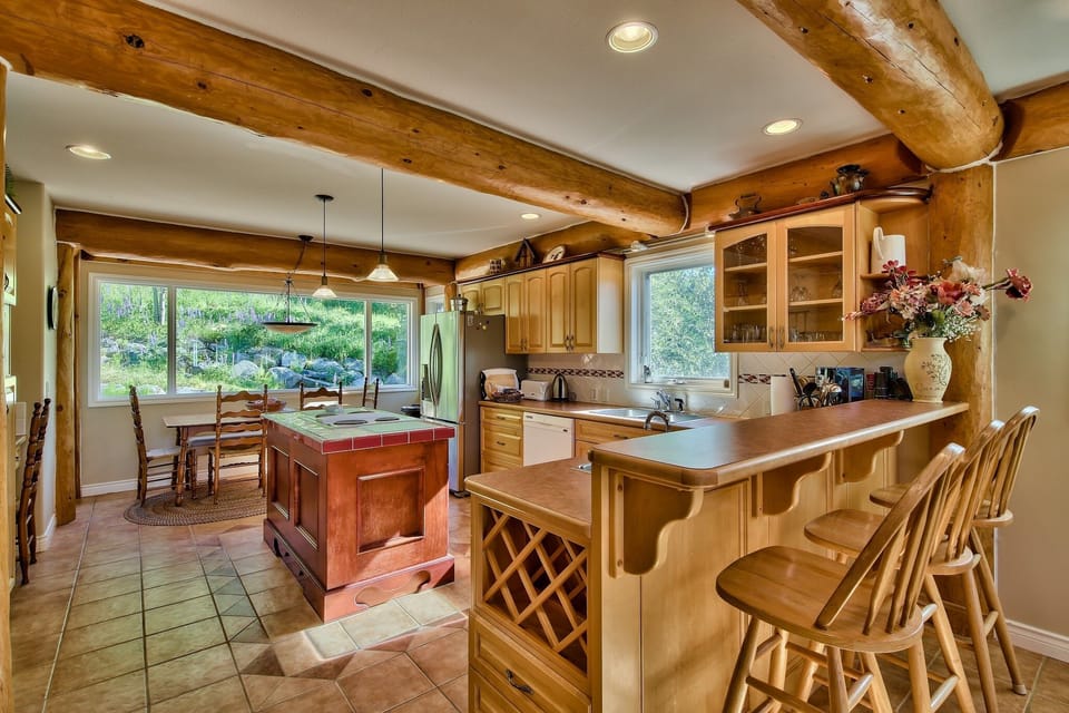 Open kitchen, 3 eating areas, no one misses the action!  Three seated bar area.
