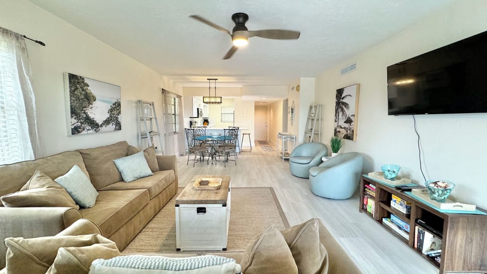 Spacious living area with a sleek 50-inch TV.